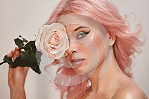 Soft-Girl Style with Trend Pink Flying Hair, Fashion Make-up. Blond Woman Face with Freckles, Blush Rouge, Rose Flowers
