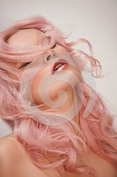 Soft-Girl Style with Trend Pink Flying Hair, Fashion Make-up. Blond Woman Face with Freckles, Blush Rouge, Rose Hair