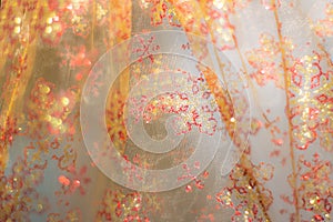 Soft glowing golden yellow festive background. Colored abstract blurry backgrounds. New Year`s and Christmas