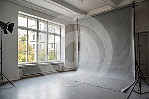 Soft gray studio room background with window light
