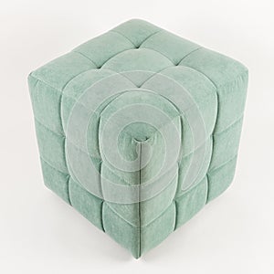 Soft green pouf on a white background