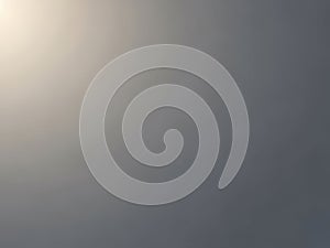 Soft grey gradient background with subtle light effects