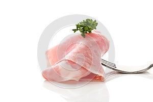 Soft ham slice wrapped on fork