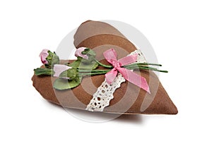 Soft heart made of cloth with pink roses isolated on white