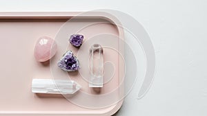 The soft hues of the tray complement the natural colors of the crystals