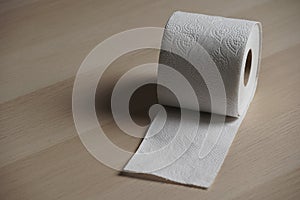 Soft hygienic toilet paper on wood background