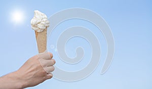 Soft ice cream cone on blue sky