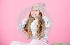 Soft knitted accessory. Tips for caring for knitted garments. Child long hair warm soft woolen hat enjoy softness. Kid