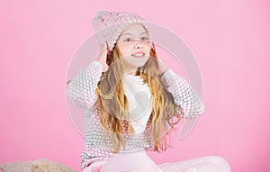 Soft knitted accessory. Tips for caring for knitted garments. Child long hair warm soft woolen hat enjoy softness. Kid