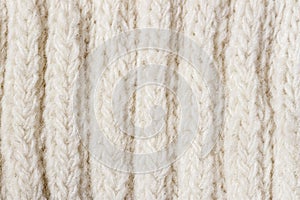 Soft knitted wool texture, warm white background, soft yarn. Loops pattern