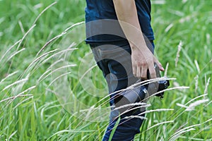 Soft Light and Blurred image, A photographer capturing the beautiful Grass flowers in the evening with a DSLR camera,