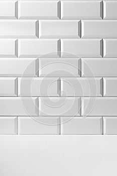 Soft light white abstract scene grey gradient of white glossy ceramic rectangle tiles on wall, wood floor mockup