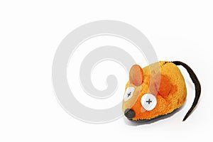 Soft orange mouse toy made of artificial wool, handmade on a white background