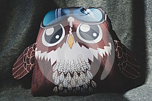Soft owl toy on light background
