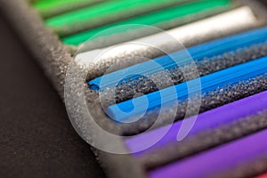 Soft pastel chalks set close up macro, black background