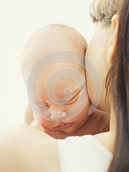 Soft photo closeup portrait is sweet sleep baby in mother