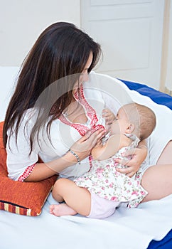 Soft photo young mother feeding breast her baby