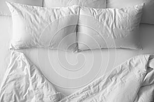 Soft pillows on comfortable bed photo