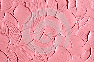 Soft pink cosmetic clay facial mask, cream texture close up, selective focus. Abstract background with brush strokes