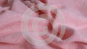 Soft pink fabric Wool background. Alpaca wool mohair clothes texture closeup. Natural Cashmere Soft and fluffy merino