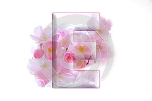 Soft pink LETTER E , romantic sign, cherry blossom alphabet, isolated design element