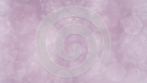 Soft pink and mauve textured bokeh background with mandalas photo