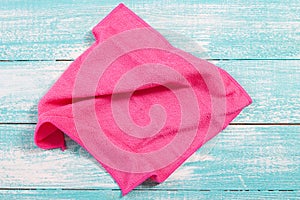 Soft pink napkin close up on wooden background