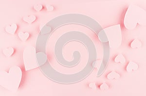 Soft pink paper hearts on light background, copy space.