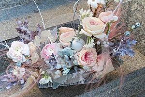 Soft pink wedding bouquet with peony and roses by florist close up