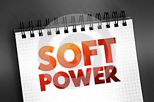 Soft power - ability to attract co-opt rather than coerce, text concept on notepad