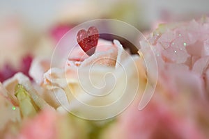 Soft roses and red heart bouquet macro decoration background