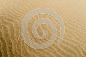 Soft sand textured background. Yellow color.