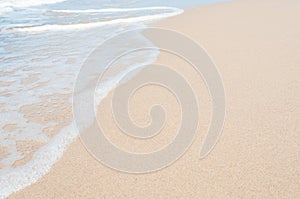 Soft sea wave on clean sandy beach