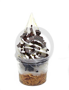 Soft serve ice cream in a cup with topping