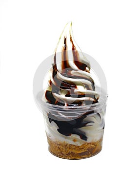 Soft serve ice cream in a cup with topping