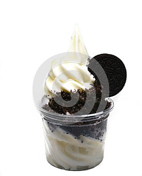 Soft serve ice cream in a cup with topping