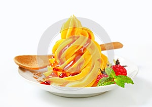 Soft serve ice cream with raspberry sauce photo