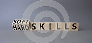 Soft Skills and Hard Skills symbol. Turned cubes with words Soft Skills and Hard Skills. Beautiful grey background. Businessman