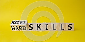 Soft Skills and Hard Skills symbol. Turned cubes with words Soft Skills and Hard Skills. Beautiful yellow background. Businessman