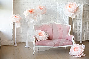 Soft sofa with pretty pink fabric upholstery