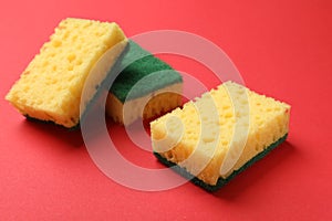 Soft sponges on red background. Cleaning tool