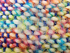 Soft and stringy multicolored woven yarn, perfect for bright backgrounds.