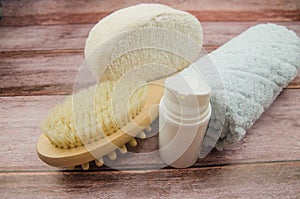 Soft towel and bath accessories on table