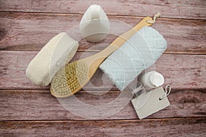 Soft towel and bath accessories on table