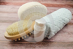 Soft towel and bath accessories on table