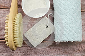 Soft towel and bath accessories on table