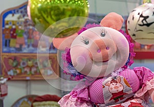 Soft toy pig in a cap with ruches and a pink dress