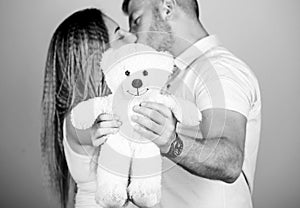 Soft toy teddy bear gift. Guy and girl cuddling. Happy family. Valentines day holiday. Pregnancy concept. Man and woman