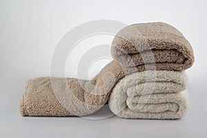 Soft and warm stack of folded blankets isolated on white