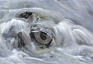 Soft Water Rushing Over Rocks photo